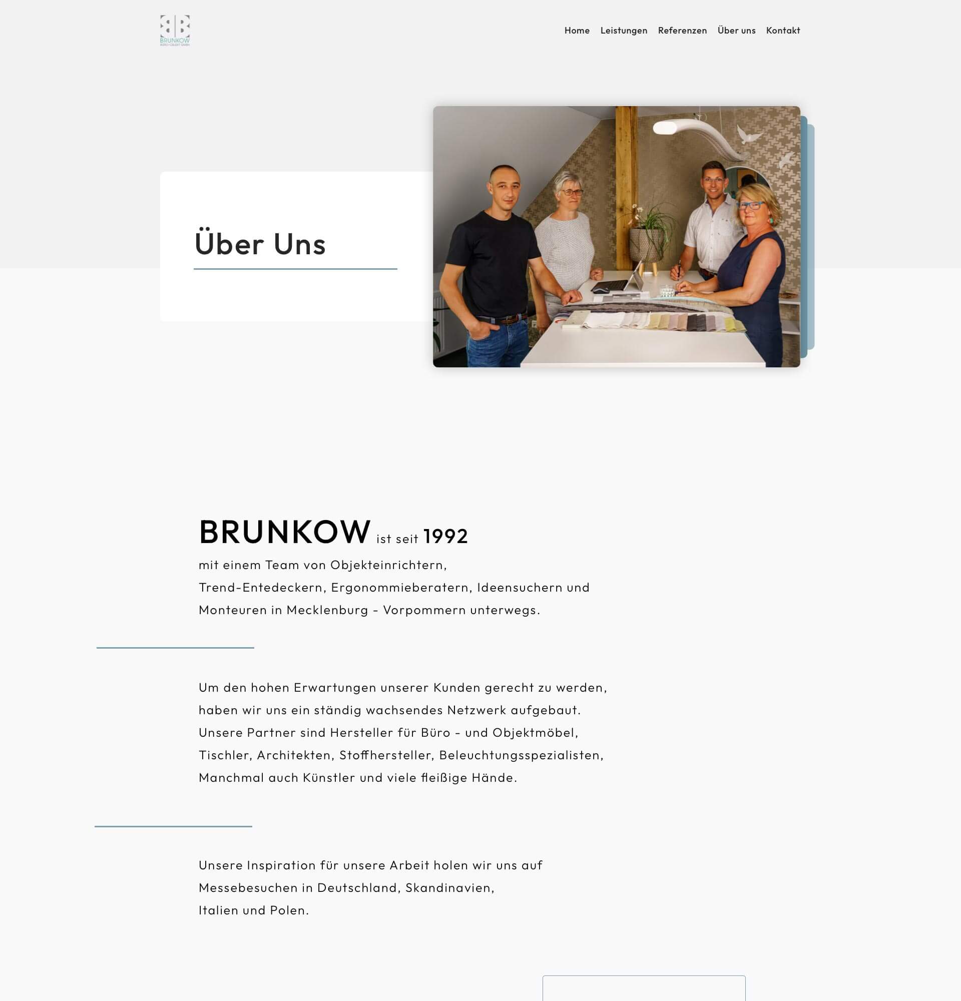a website page with a picture of two men and a woman