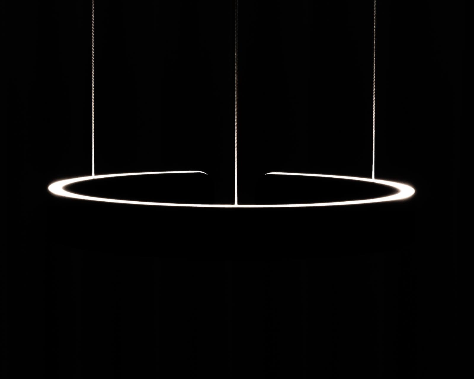 a black and white photo of a circular light fixture